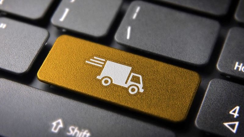 Imagem de uma tecla de computador com o desenho de um caminhão de entregas